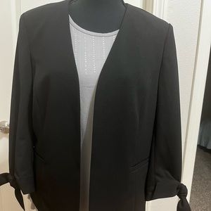 Women’s buttonless black blazer with ties on sleeves